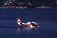 C-FOEQ @ CYHC - Air BC De Havilland Canada DHC-6-100 Twin-Otter taxiing through vancouver Harbour, B.C., Canada, 1987 - by Van Propeller