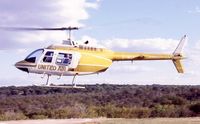 Z-WLY @ FVFA - Scan of United Air B206 lifting-off from Victoria Falls Helipad. - by FerryPNL