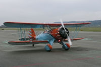 D-EALM @ LSZG - It must be rather refreshing in an open biplane in winter. Ready to taxi at Grenchen. - by sparrow9