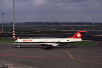 HB-IVE @ EHAM - Swissair Fokker 100 taxiing at Schiphol airport, the Netherlands, 1989 - by Van Propeller