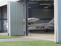 VH-IVW @ YRED - flying club member in hangar - by magnaman