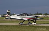 N700HH @ KOSH - RV-10 taxing out for a flight at Airventure - by Eric Olsen