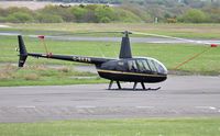 G-EEZR @ EGFH - Visiting R44 Raven II helicopter. - by Roger Winser