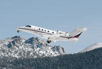 N340QS @ KTVL - NetJets 2014 Embraer Phenom 300 departing at South Lake Tahoe Airport, CA. - by Chris Leipelt