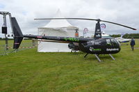 G-REGJ @ EGTB - Robinson R44 Raven II at Wycombe Air Park. - by moxy