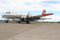 N8502R @ ENV - Douglas C-54T Skymaster.  Sitting at Wendover Airport, UT on 18 May 2018, the airplane is becoming an eyesore due to neglect and the environment.  Oil seeps from the engines onto the tarmac, starboard elevator has torn canvas. - by Del Mitchell