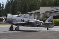 N5542V @ KPWT - A 1958 T-6G sits on the ramp at Bremerton National Airport as it waits to go up and take part in a formation clinic. - by Eric Olsen