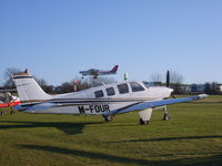 M-FOUR @ EGHP - Parked at Popham airfield EGHP with G-BEOH landing over the top - by Marc Mansbridge