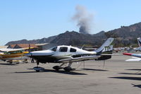 N394MA @ SZP - 2014 Cessna TTx T240, Continental TSIO-550C 310 Hp at 2,600 rpm, 235 kts, 4 place. New fire in background across the river-South Mountain-Fire Fighting units dispatched - by Doug Robertson