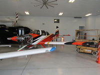 N324TM @ 79C - in hangar at brennand - by magnaman