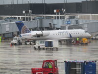 N987SW @ ORD - at rainy chicago - by magnaman