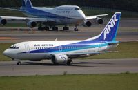 JA8595 @ RJCC - Arrival of Air nippon B735 with larger company plane behind it. - by FerryPNL