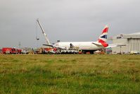 G-YMMM @ EGLL - Two days after the miraculous crash landing on 17th January 2008 whilst operating British Airways flight BA038 from Beijing and the crane has lifted the left wing. It has now been written off and broken up at London-Heathrow in 2009. - by Glyn Charles Jones
