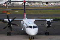 VH-QOE @ YSSY - to gate - by Bill Mallinson