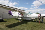 N954FE @ OSH - 1987 Cessna 208B Grand Caravan, c/n: 208B0064 - by Timothy Aanerud