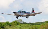 G-OSUS @ EGFH - Visiting Mooney M20K departing Runway 22. - by Roger Winser