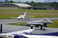 7L-WD @ LOWG - OE-FCW (Cessna 525) with an Eurofighter of the Austrian AF at LOWG - by Paul H