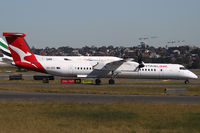 VH-QOS @ YSSY - taxi from 3-4R - by Bill Mallinson