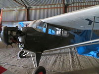 G-BRXL @ EGSL - 1946 Aeronca Chief in US Army livery hangared at Andrewsfield - by Chris Holtby