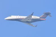 N518FX @ KLAX - Flexjet CL300 departing from a hazy LAX - by FerryPNL