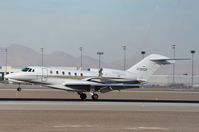 N187CR @ KLAS - Pakawalup Ce750 landing during an airshow at Nellis in the background. - by FerryPNL