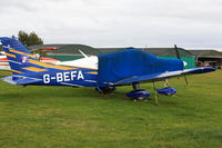 G-BEFA @ EGTN - Parked and covered at Enstone Airfield Oxon - by Chris Holtby