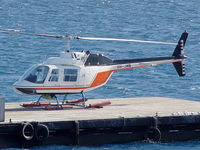 VH-JMN - Front Port side view of Bell 206B JetRanger II VH-JMN Cn 1353 on a pontoon in the Great Barrier Reef – off Cairns QLD - on 28Jun2006. The helo is fitted with ‘pop-out floats’ for over-water operations. - by Walnaus47