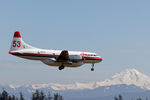 C-GKFO @ CYXX - Landing on 19 with Mt.Baker, Wa in the background - by Guy Pambrun