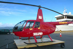 ZK-IBJ @ NZQW - Close-cropped front Portside view of Helipro Robinson R44 Raven ZK-IBJ Cn 1008 parked on a ground handling platform at NZQW Wellington - Queens Wharf Heliport NZ - on 14Apr2010.