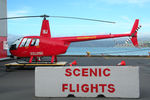 ZK-IBJ @ NZQW - Rear Portside view of Helipro Robinson R44 Raven ZK-IBJ Cn 1008 parked on a ground handling platform at NZQW Wellington - Queens Wharf Heliport NZ - on 14Apr2010.