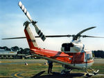 VH-AHH @ YSCB - Rear Stbd view of parked Bell 412 Helicopter VH-AHH Cn 33084 Code H, photographed at Canberra Airport in Mar 1987. Note pop-out floats on the skids. (Later Regd to NSCA as VH-NSV 16JUN87 - 28MAY89.) Previously Registered as N3172D in USA.