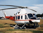 VH-AHH @ YSCB - Front Stbd view of parked Bell 412 Helicopter VH-AHH Cn 33084 Code H, photographed at Canberra Airport in Mar 1987. Note pop-out floats on the skids. (Later Regd to NSCA as VH-NSV 16JUN87 - 28MAY89.) Previously Registered as N3172D in USA.