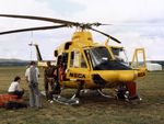 VH-NSO @ YSCB - NSCA Bell 412EP VH-NSO Cn 33089 (Code 11), with crew at the 1988 (Bi-Centennial) Canberra Air Pageant at Canberra Airport YSCB on 13Mar1988. The Bell 412 is equipped with ‘pop-out’ floats on the skids, and a personnel hoist and Nite-Sun searchlight.