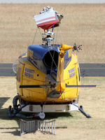 N49732 @ YPJT - Telephoto Rear view of McDermott Aviation Bell 214B-1 Biglifter N49732 Cn 28005 Helitack 672 parked at Jandakot Airport YPJT West Australia on 18Nov2013. Equipped with ‘under-cabin’ water tank, with ‘pick-up’ hose. - by Walnaus47