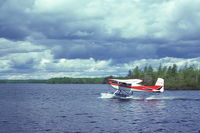 CF-LSB - CF-LSB delivering food to a geologists' mineral exploration camp, McVickar Lake, northwestern Ontario, July 1975. Likely flew out of Pickle Lake water base, but I am uncertain. - by Andy Fyon