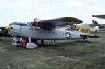 N4666T @ OSH - Decked out in Military scheme - by Charlie Pyles