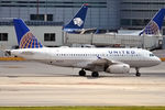 N823UA @ KMIA - Taxiing in after arrival - by Robert Kearney