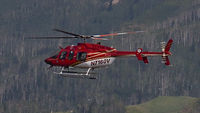 N7160V - Very attractive heli captured before a summertime landing near the Steamboat Springs Ski Area. - by Arnold Bookheim Jr.