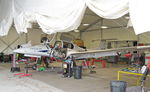 N469WW @ EGTR - In the maintenance hangar at Elstree - by Chris Holtby
