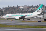N737KA @ KBFI - New livery for Kaiser Air promoting their revitalized Oakland/Hawaii service. - by Joe G. Walker
