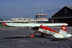 HB-DUC @ LSZG - At grenchen, with the old tower and hangar, before leaving for Denmark. Scanned from a slide.