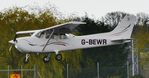 G-BEWR @ EGHH - Landing 08 - by John Coates