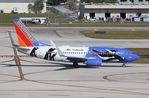 N280WN @ KFLL - SWA 737 Penguin One zx FLL - by Florida Metal