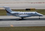 N374QS @ KMIA - Phenom 300 zx - by Florida Metal