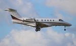 N394QS @ KORL - Phenom 300 zx - by Florida Metal