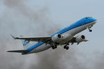 PH-EZW @ EGLC - Departing through the smoke of a near by fire from London City Airport. - by Graham Reeve