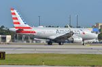 N9023N @ KMIA - American A319 lined-up - by FerryPNL