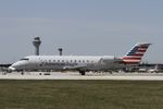 N470ZW @ KORD - CRJ2 Air Wisconsin/American Eagle Canadair Regional Jet CRJ-200 N470ZW AWI6017 ORD-SPI, departing on 22L ORD during the solar eclipse. - by Mark Kalfas