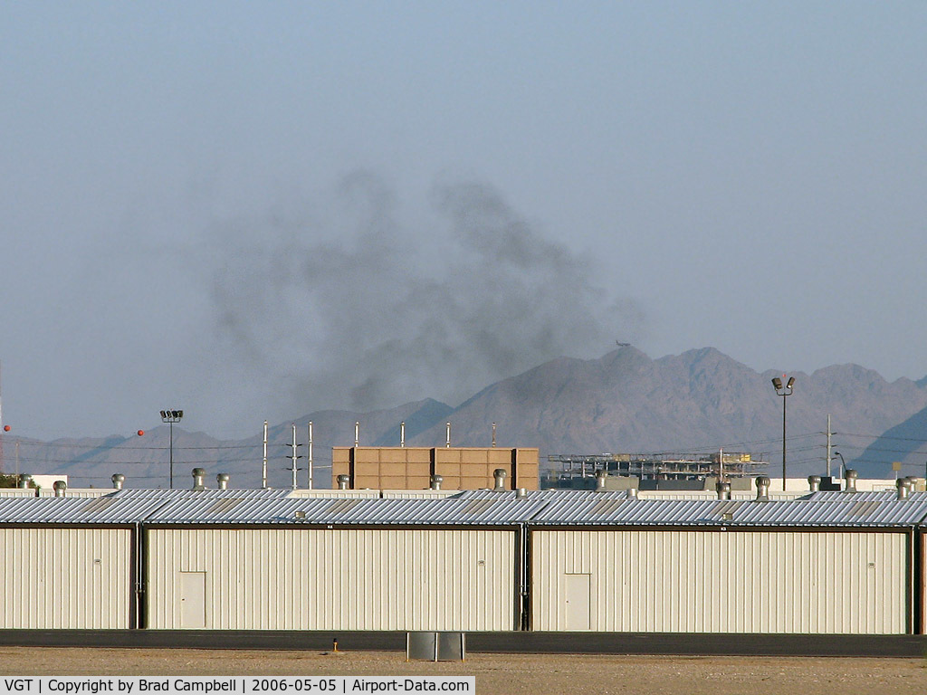 North Las Vegas Airport (VGT) - I was shooting at VGT & looked towards the taxi area to see if anything new was coming up. This is what I saw. My house is located in that direction and I almost went home. But hey, there is an airplane in the shot!