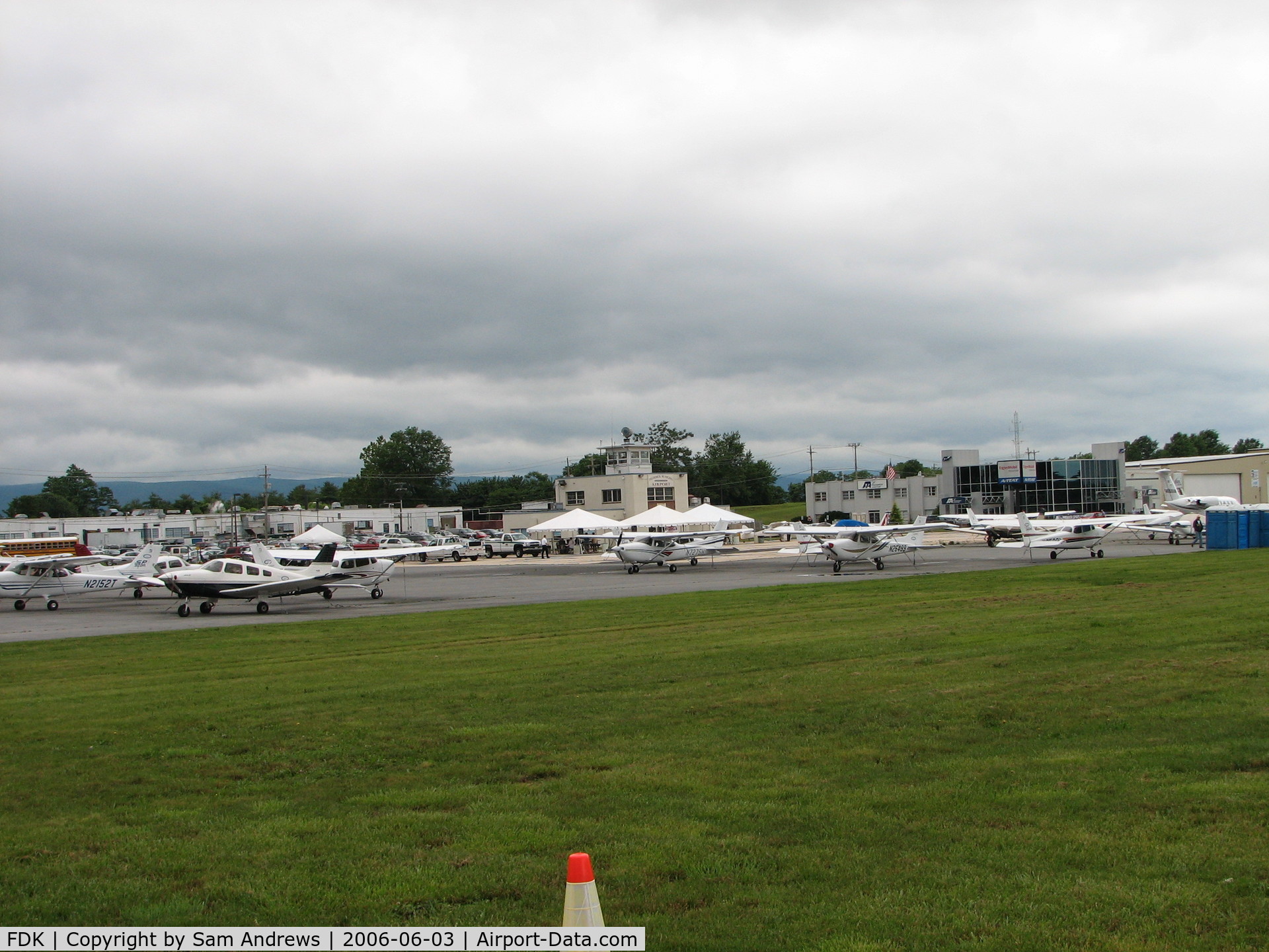 Frederick Municipal Airport (FDK) - This is the Frederick Flight Center ramp.  On any other day there would not be the white tents in front of the old tower, but this was AOPA Fly-in day.
